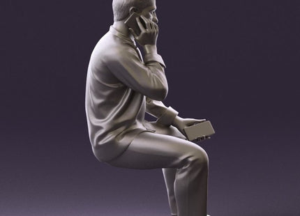 Smart Male Sitting Talking On A Mobile Phone Figure