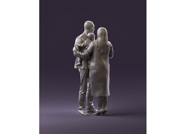 Young Couple Posing With Child Figure