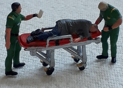 Male Paramedic/ambulance Crew And Patient On Trolley Figure