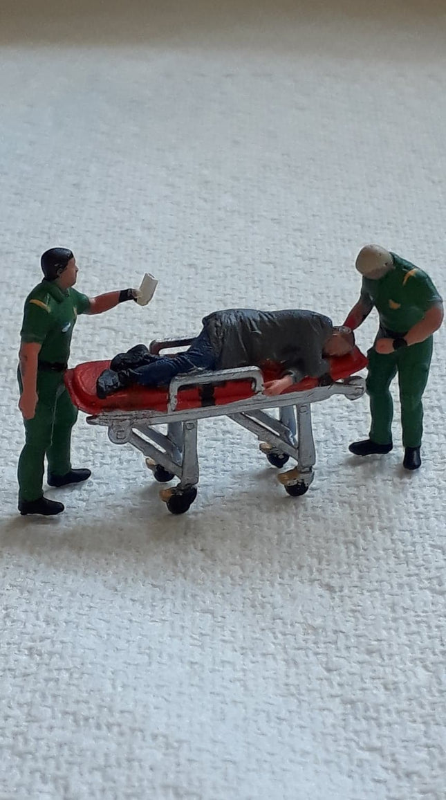 Male Paramedic/ambulance Crew And Patient On Trolley Figure