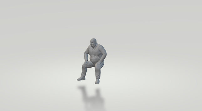 Large Male Sitting Down Figure