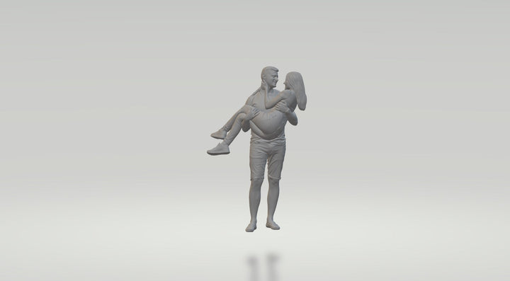 Young Couple Female In Arms Of Male Figure